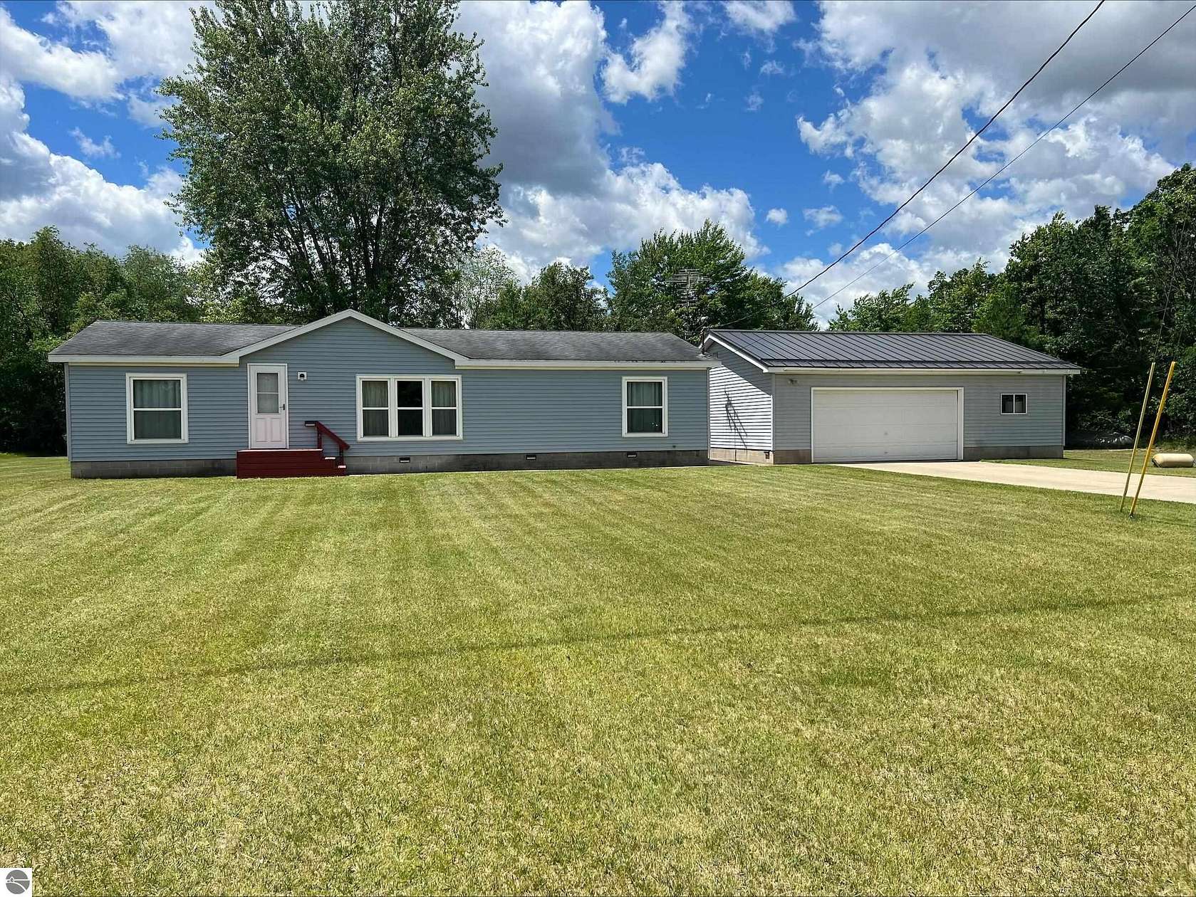 1.5 Acres of Land with Home for Sale in Sumner, Michigan