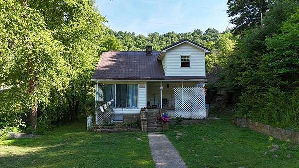 10 Acres of Land with Home for Sale in Leburn, Kentucky