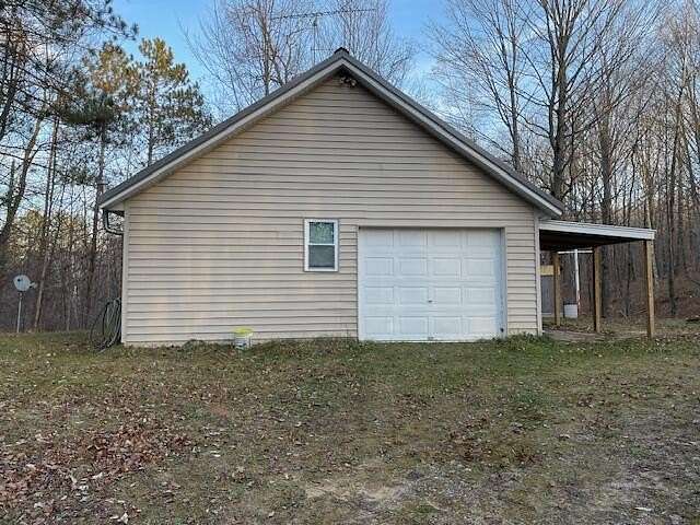 10 Acres of Recreational Land with Home for Sale in Lupton, Michigan