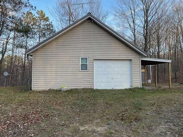10 Acres of Recreational Land with Home for Sale in Lupton, Michigan