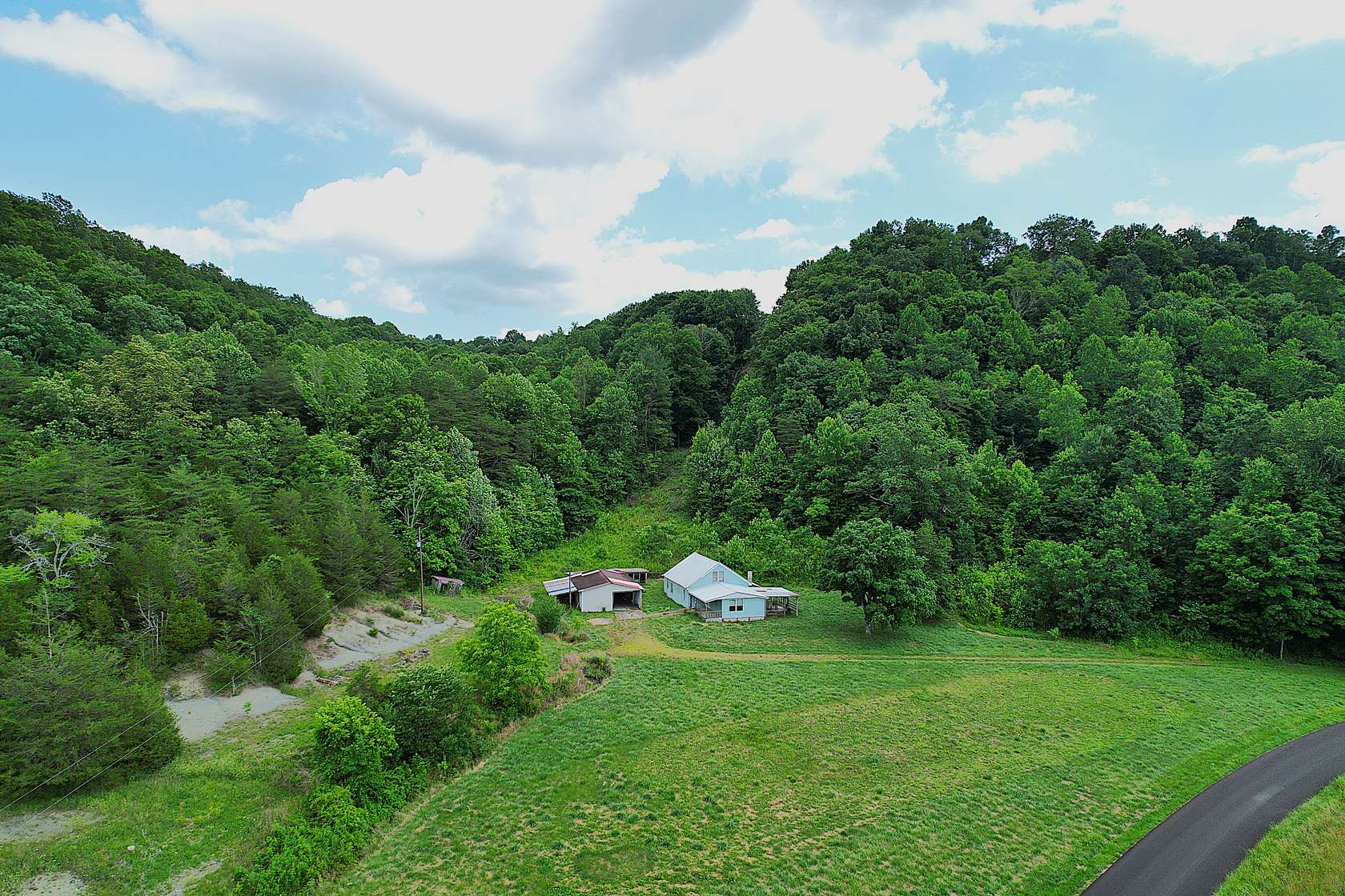 7.5 Acres of Land with Home for Sale in Liberty, Kentucky