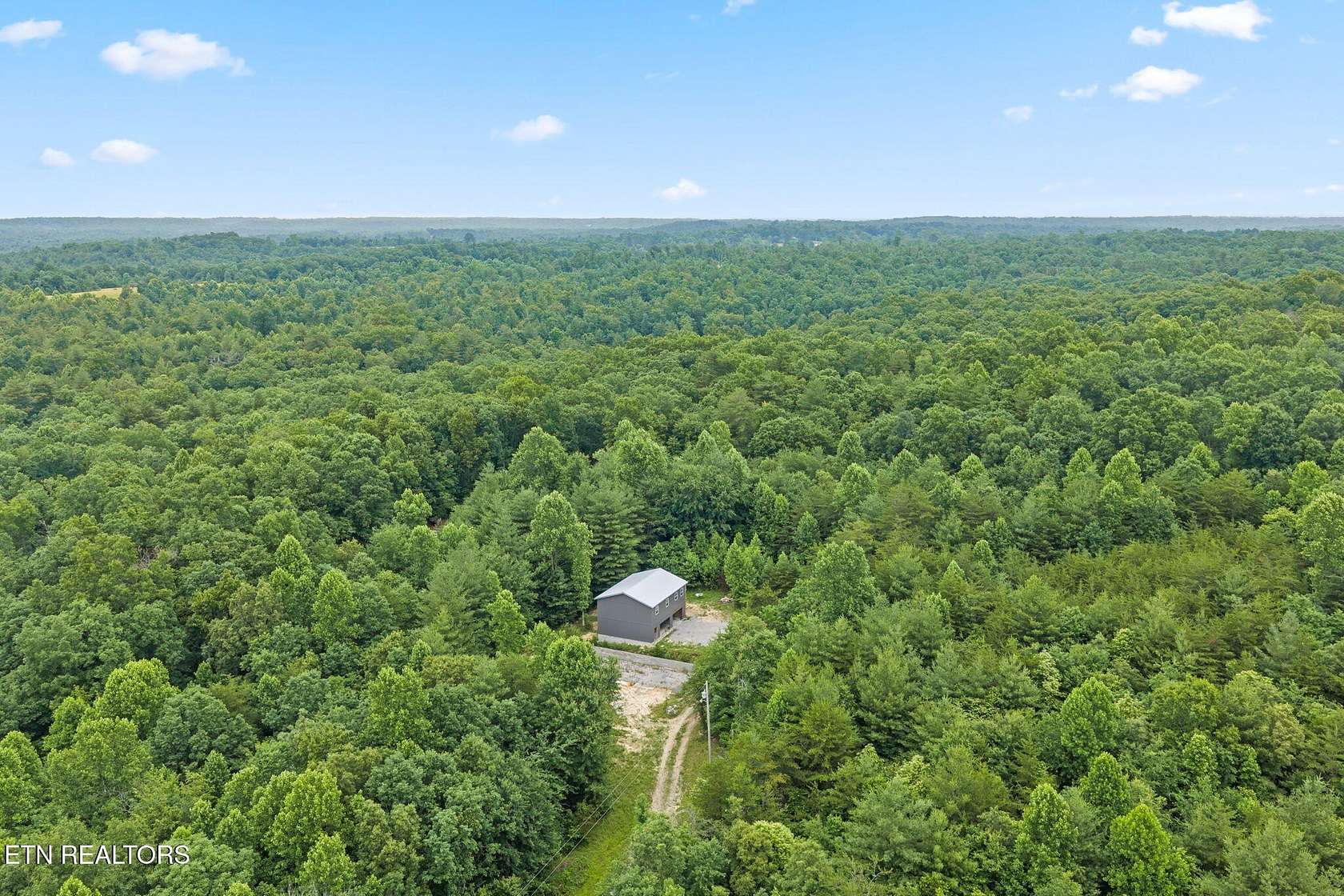5 Acres of Land with Home for Sale in Deer Lodge, Tennessee