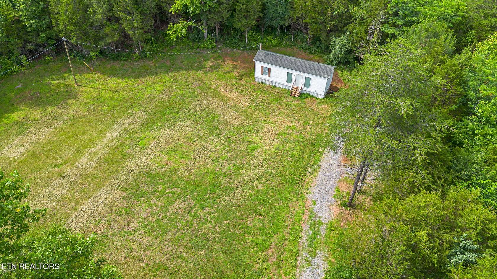 7.36 Acres of Land with Home for Sale in Calhoun, Tennessee