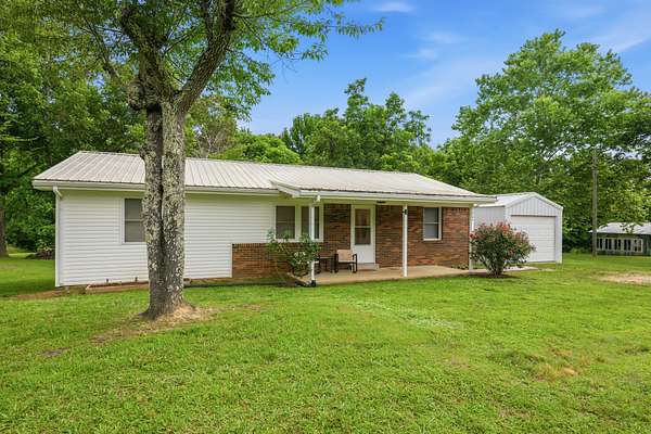 1.65 Acres of Land with Home for Sale in Scotts Hill, Tennessee