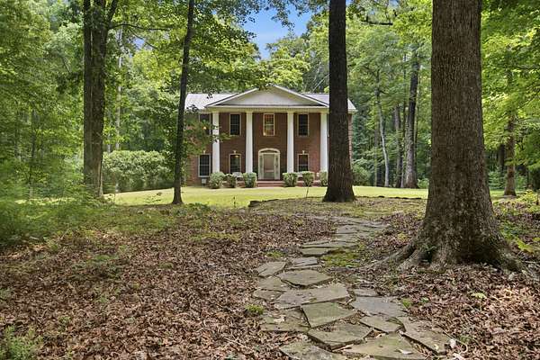 2.12 Acres of Land with Home for Sale in Burns, Tennessee