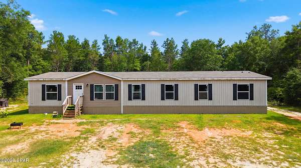 5.54 Acres of Land with Home for Sale in Milton, Florida