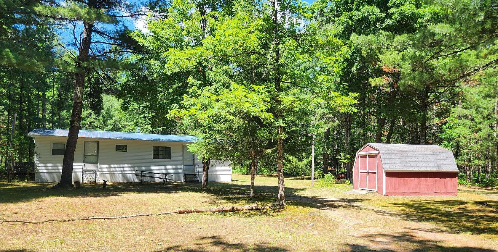 7.5 Acres of Land with Home for Sale in Idlewild, Michigan