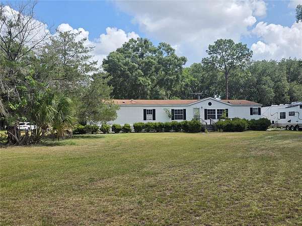 4.64 Acres of Land with Home for Sale in Summerfield, Florida
