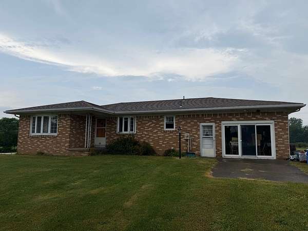 6.68 Acres of Land with Home for Auction in Lake City, Pennsylvania