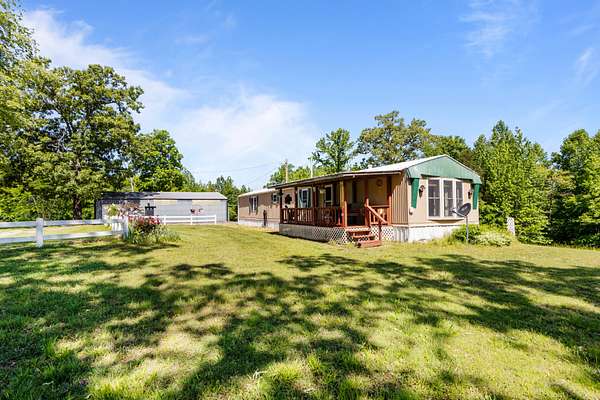 31 Acres of Recreational Land with Home for Sale in Camden, Tennessee