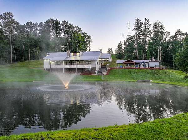 90.9 Acres of Land with Home for Sale in Buchanan, Georgia