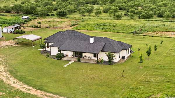 18.8 Acres of Land with Home for Sale in Devine, Texas