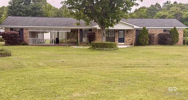 9.6 Acres of Land with Home for Sale in Irvington, Alabama