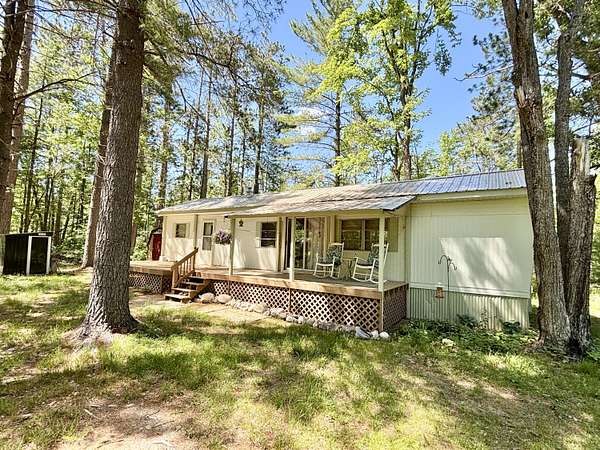 10 Acres of Recreational Land with Home for Sale in Lewiston, Michigan