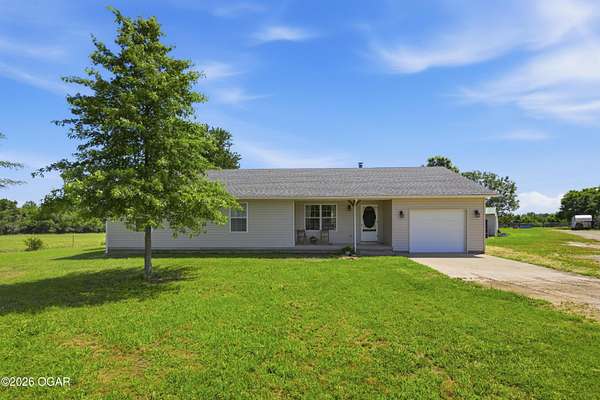 68.9 Acres of Agricultural Land with Home for Sale in Pierce City, Missouri