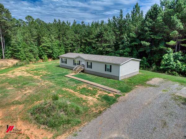 14.8 Acres of Land with Home for Sale in Springhill, Louisiana