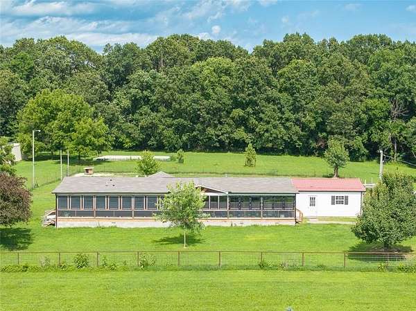 19.7 Acres of Land with Home for Sale in Benton Township, Missouri