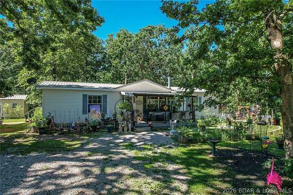 8.8 Acres of Land with Home for Sale in Climax Springs, Missouri