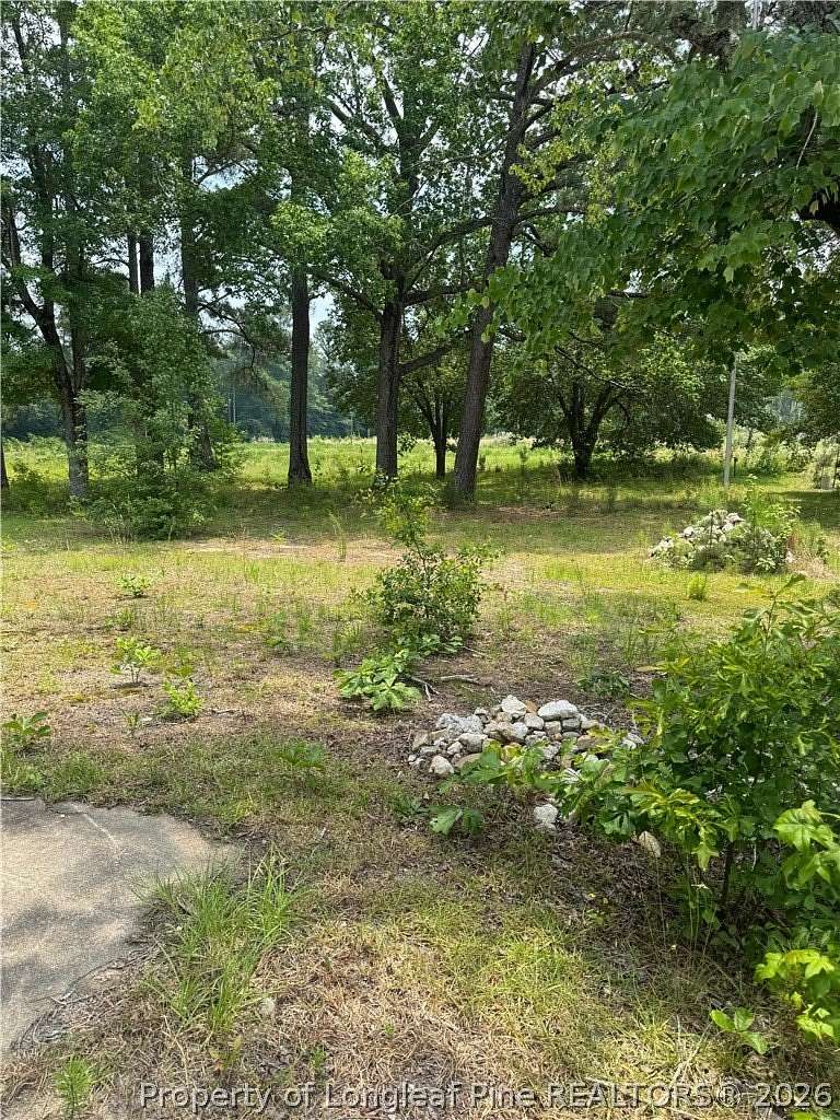 7.12 Acres of Land with Home for Sale in Spring Lake, North Carolina
