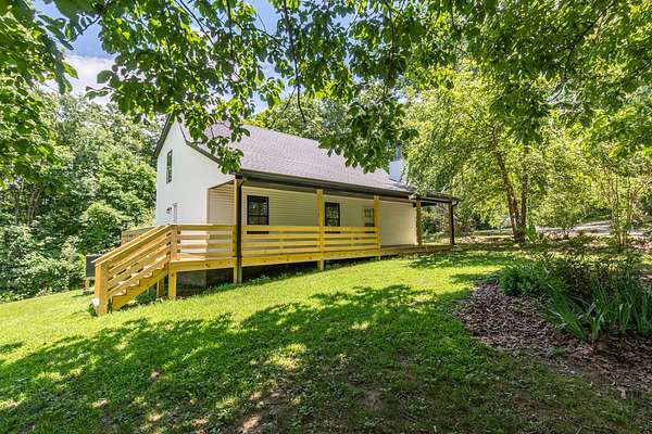 11.2 Acres of Land with Home for Sale in Pegram, Tennessee
