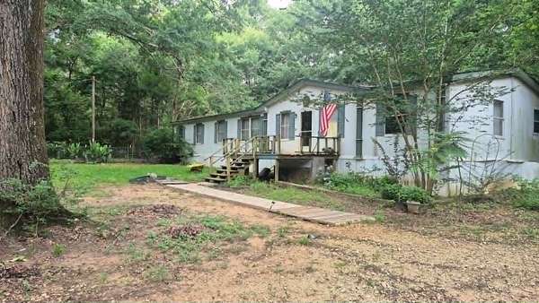 10.4 Acres of Recreational Land with Home for Sale in Grapeland, Texas