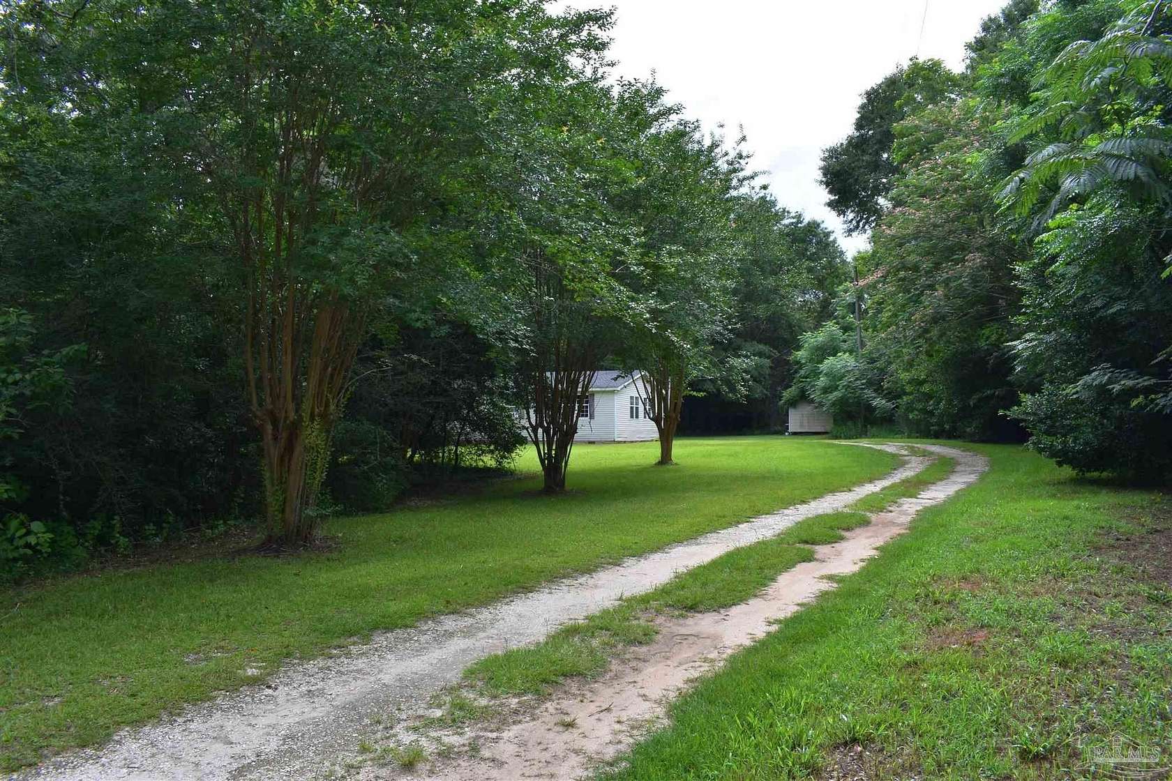 4.88 Acres of Land with Home for Sale in McDavid, Florida