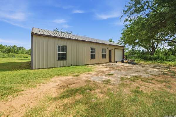 5 Acres of Land with Home for Sale in Devine, Texas