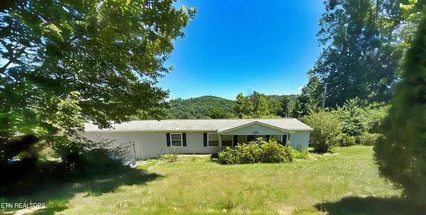 1.78 Acres of Land with Home for Sale in Caryville, Tennessee