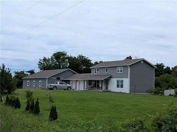 19.7 Acres of Land with Home for Sale in Garden City, Missouri