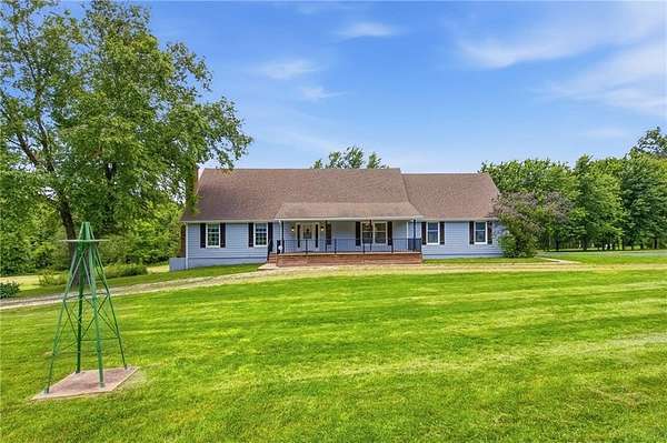 4.57 Acres of Land with Home for Sale in Peculiar, Missouri