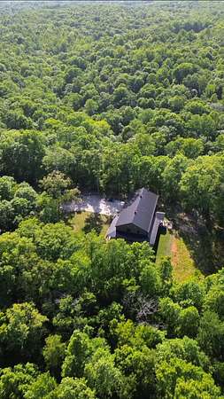 28.9 Acres of Recreational Land with Home for Sale in Burns, Tennessee