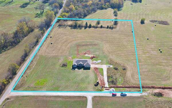 6.66 Acres of Land with Home for Sale in Everton, Missouri