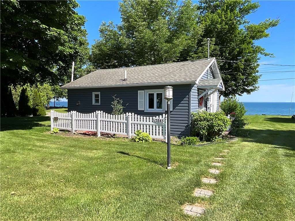 0.82 Acres of Land with Home for Sale in Waterport, New York
