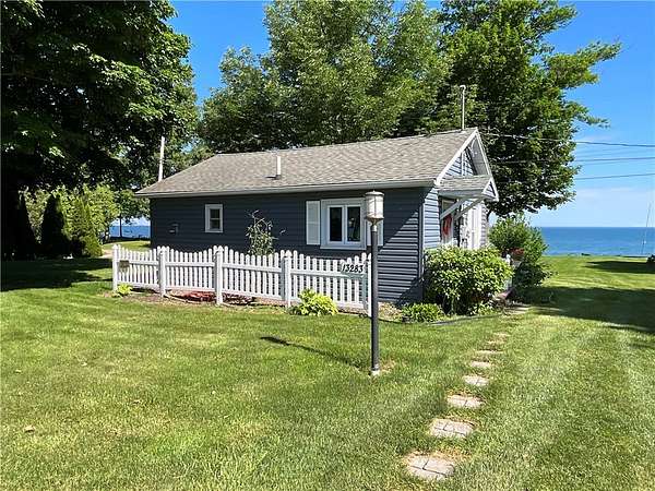 0.82 Acres of Land with Home for Sale in Waterport, New York