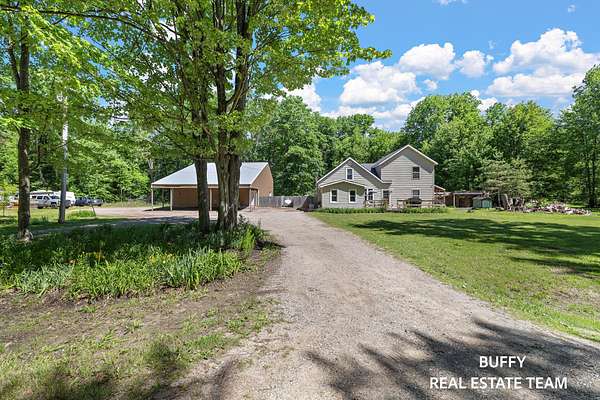 10 Acres of Recreational Land with Home for Sale in Grant, Michigan