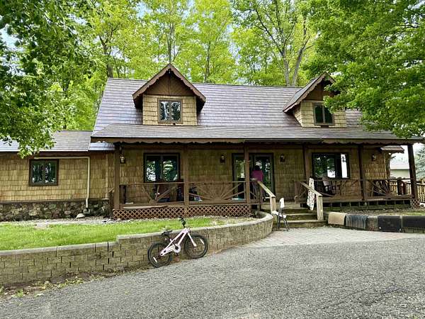 11 Acres of Recreational Land with Home for Sale in Rose City, Michigan