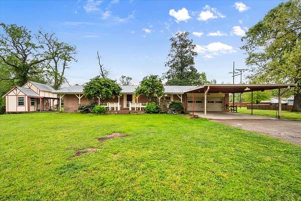 6.87 Acres of Land with Home for Sale in Conroe, Texas