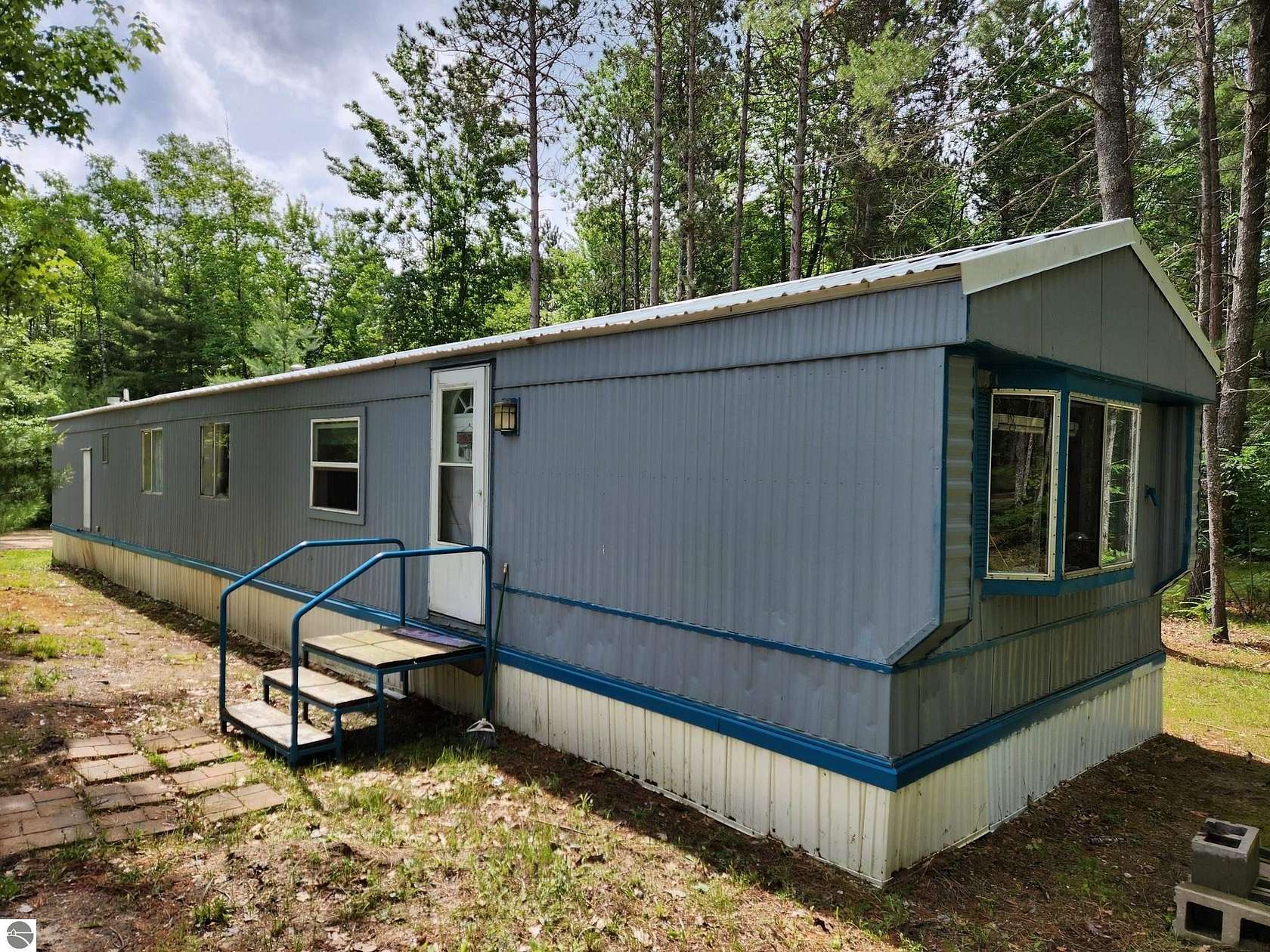 5 Acres of Land with Home for Sale in Kalkaska, Michigan