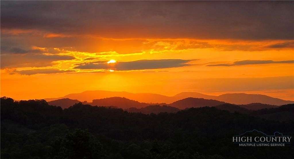 13.5 Acres of Land with Home for Sale in Lansing, North Carolina