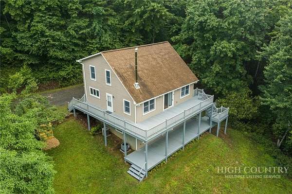 13.5 Acres of Land with Home for Sale in Lansing, North Carolina