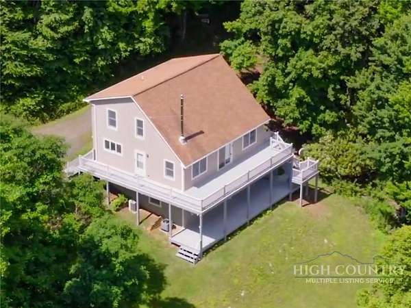 13.5 Acres of Land with Home for Sale in Lansing, North Carolina