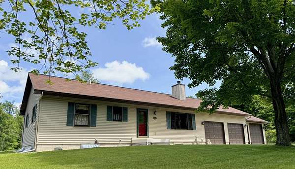 1.67 Acres of Land with Home for Sale in Alanson, Michigan