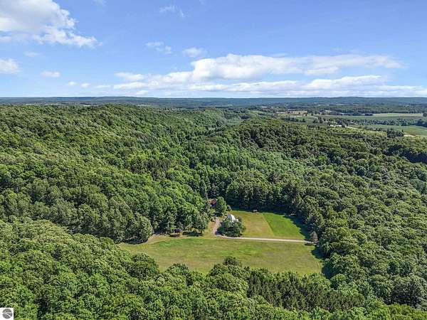 215 Acres of Recreational Land with Home for Sale in Cedar, Michigan