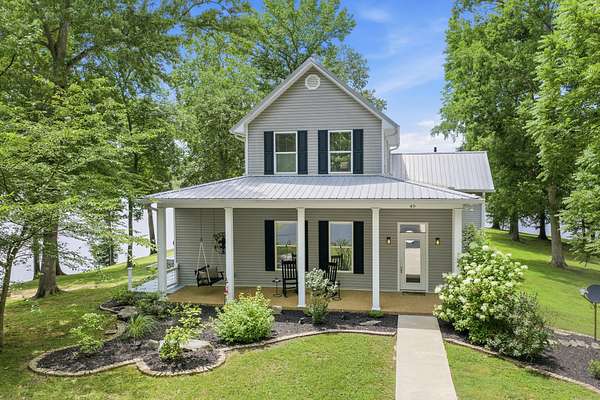 6.86 Acres of Land with Home for Sale in Parsons, Tennessee