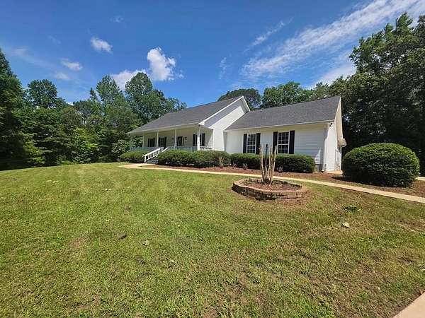 6.6 Acres of Land with Home for Sale in Anniston, Alabama