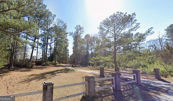 3.89 Acres of Land with Home for Sale in Stonecrest, Georgia