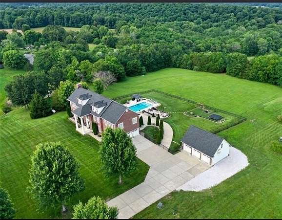 13.6 Acres of Land with Home for Sale in Grain Valley, Missouri