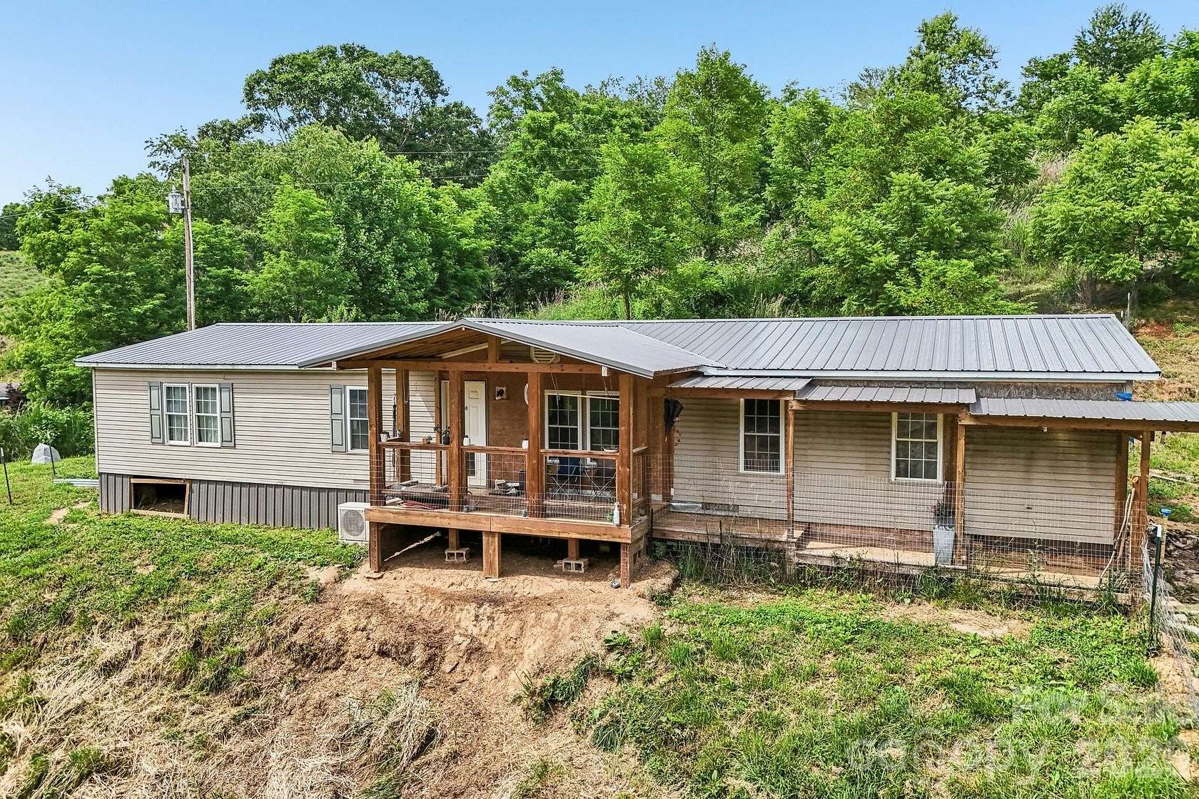 5.87 Acres of Land with Home for Sale in Marshall, North Carolina