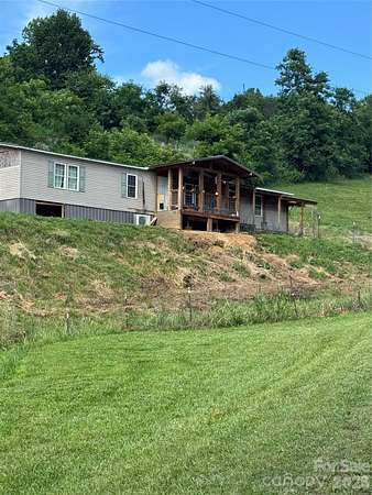 5.87 Acres of Land with Home for Sale in Marshall, North Carolina