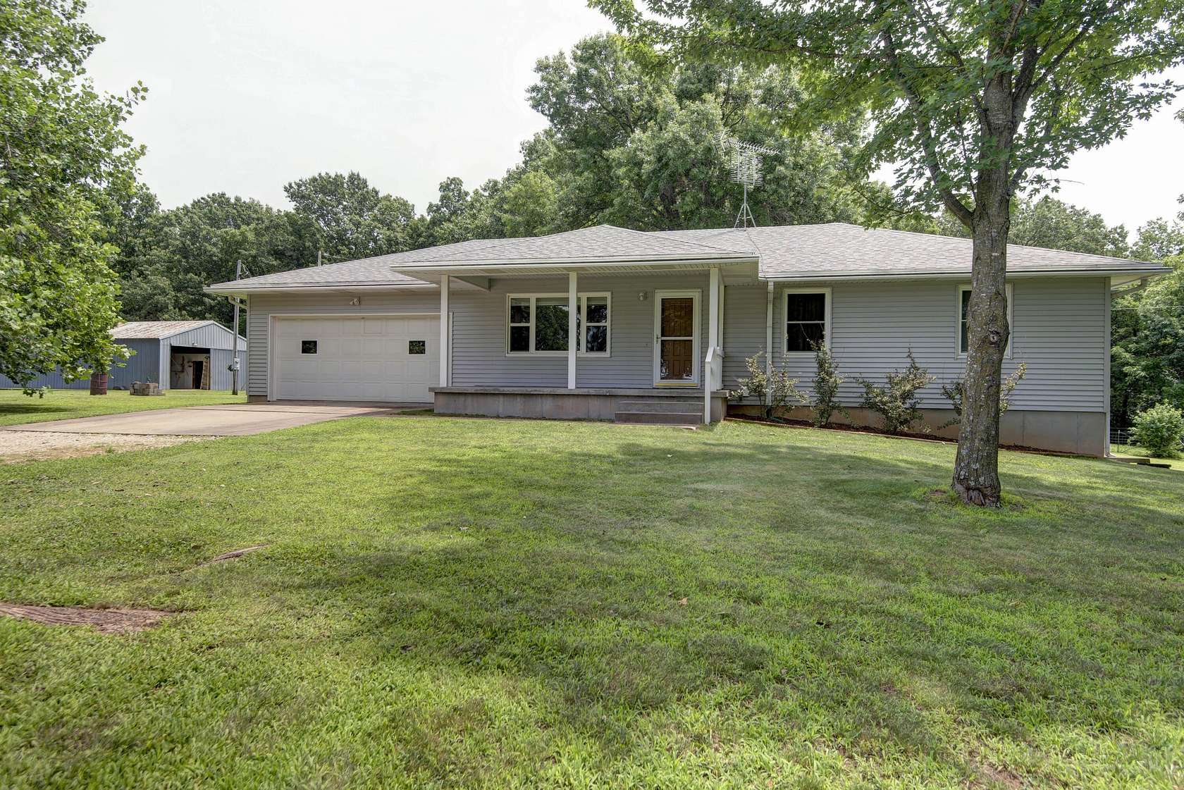24.7 Acres of Recreational Land with Home for Sale in Greenfield, Missouri